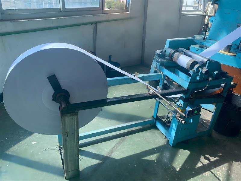 Adhesive application during paper tube production